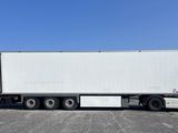 an image of a white semi truck parked in a parking lot