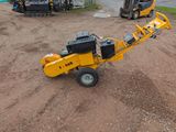 a small machine that is sitting in the dirt