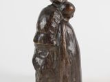 statue of a woman holding a child in her arms