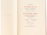 an open book on a white surface with a red border