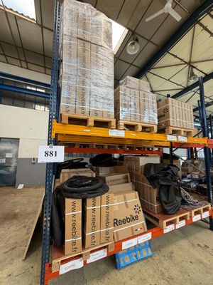 many boxes and packages on the shelves in the warehouse