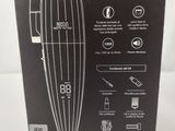 the box of a hair clipper is open on a white surface