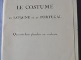 an old book sitting on top of a blue cloth covered table