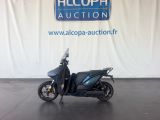 an image of a scooter parked in a showroom