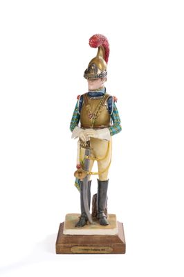 figurine of a soldier with a red hat and green jacket