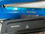 a blue machine that is sitting next to a blue box