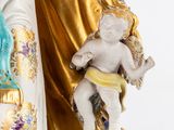 a statue of a woman holding a baby in her arms
