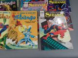 a lot of comic books sitting on a table