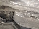 a lot of plastic bags that have fish inside of them
