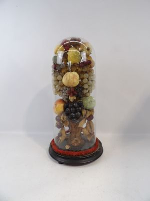 a glass jar filled with assorted fruits and nuts