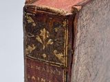 an old book sitting on top of a wooden table