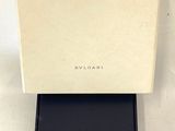 a close up of a box with a watch inside of it