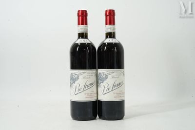 two bottles of red wine sitting next to each other on a white surface