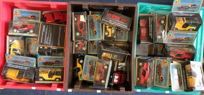 a lot of toy cars in a box on the floor