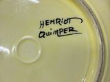 a close up of a yellow vase with writing on it