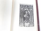 an open book with a drawing of a man and a woman on it