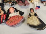 a lot of dolls that are sitting on a table