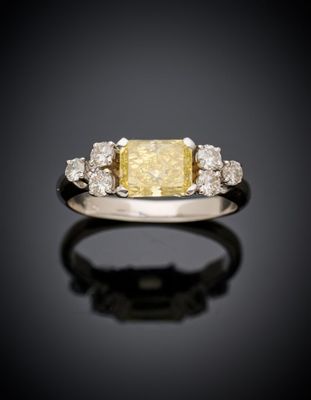 a yellow diamond and diamond ring