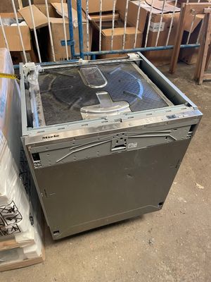 a metal box with a fan inside of it in a warehouse