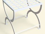 une table blanche surmontée d'un piètement métallique