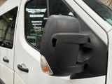 a white van with a black side view mirror on the side of it