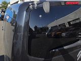a black van that is parked in a parking lot