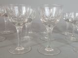 a lot of wine glasses sitting on a table