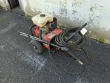 a machine that is sitting on the ground next to a wall