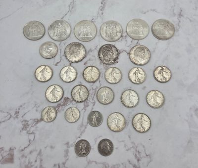 a lot of coins that are on a marble table