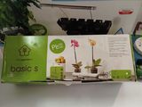 a box that has a plant in it on a table