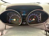 a close up of a car dashboard with gauges and speedometers