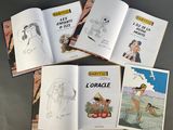 six books of children ' s drawings and coloring books on a table