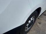 a close up of a car ' s tire on the pavement
