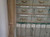 an old dresser with a lot of drawers on top of it
