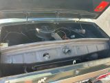 a small engine in the trunk of a car