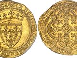 a gold coin with a shield on the front and a shield on the back