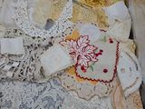 a lot of doily and laces on a table