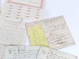 several old letters and envelopes are sitting on a white surface