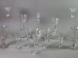 a lot of glass vases that are sitting on a table