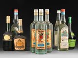several bottles of alcohol are lined up on a table