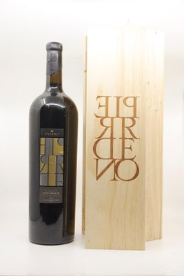a bottle of wine sitting next to a wooden box