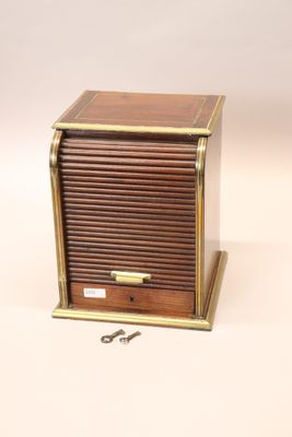 a small wooden box that has a key in it