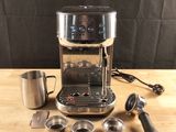 an image of a coffee machine sitting on top of a wooden table