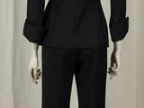 an image of a mannequin dressed in a black suit