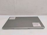 a laptop that is sitting on a white table