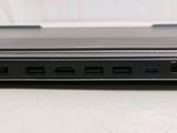 a close up of a laptop on a white surface