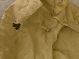 a coat that has been left on the floor