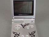a small gameboy sitting on top of a table