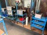 a room with a lot of electronics on the shelves