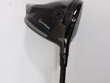 a close up of a golf club with a driver on it